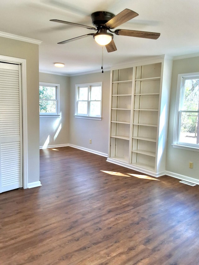 1014 Walnut St, Louisville, GA 30434 - empty room with dark wood finished floors, visible vents, ornamental molding, ceiling fan, and baseboards