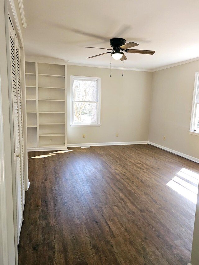 1014 Walnut St, Louisville, GA 30434 - unfurnished room with ornamental molding, dark wood-style flooring, a ceiling fan, and baseboards