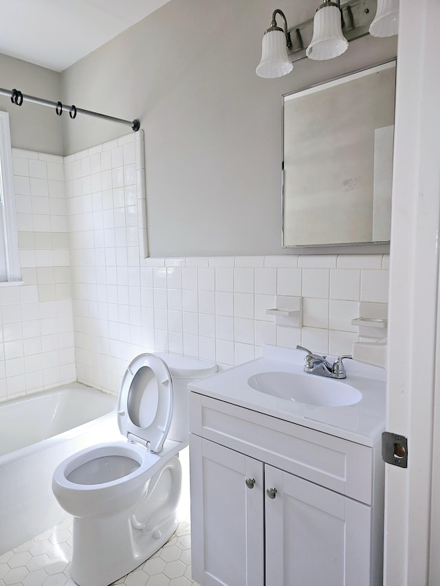 1014 Walnut St, Louisville, GA 30434 - bathroom with tile patterned flooring, toilet, vanity, tile walls, and tub / shower combination