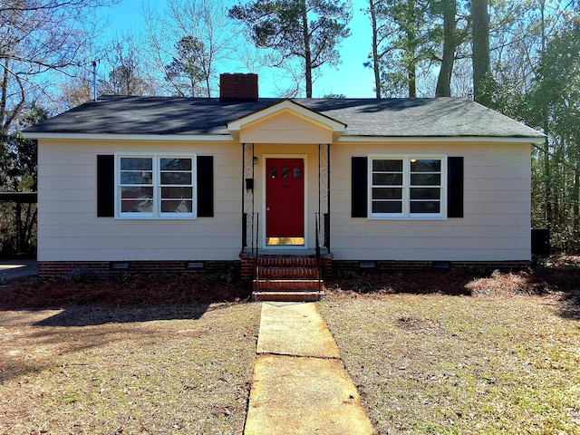 1014 Walnut St, Louisville, GA 30434 - view of front of property featuring a shingled roof, entry steps, crawl space, and a chimney