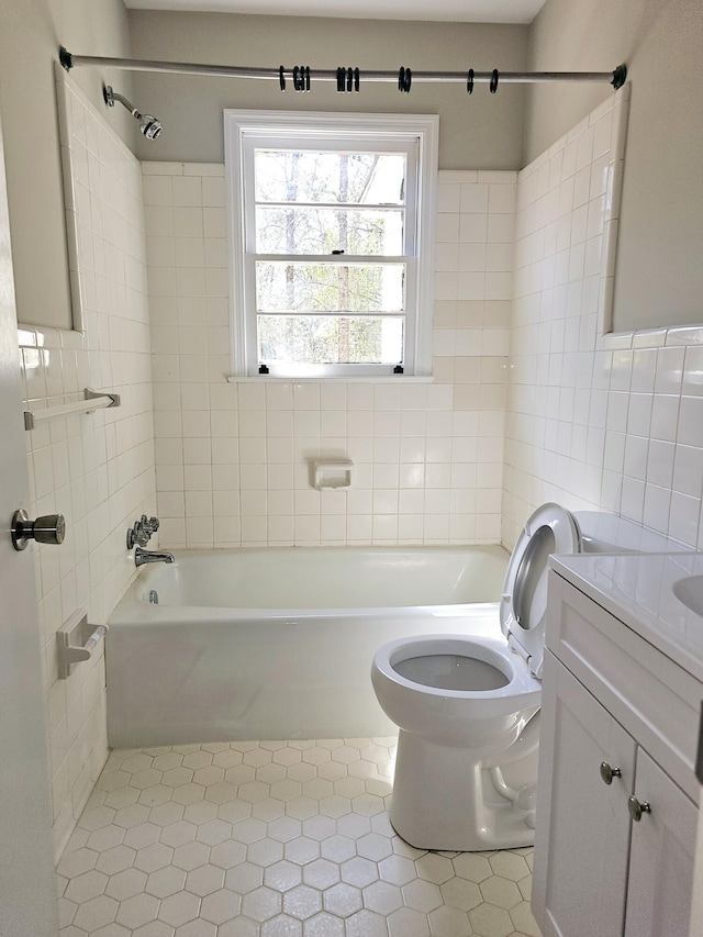 1014 Walnut St, Louisville, GA 30434 - full bathroom featuring toilet, tub / shower combination, tile walls, and vanity