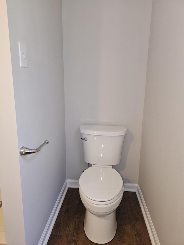 1014 Walnut St, Louisville, GA 30434 - bathroom featuring wood finished floors, toilet, and baseboards