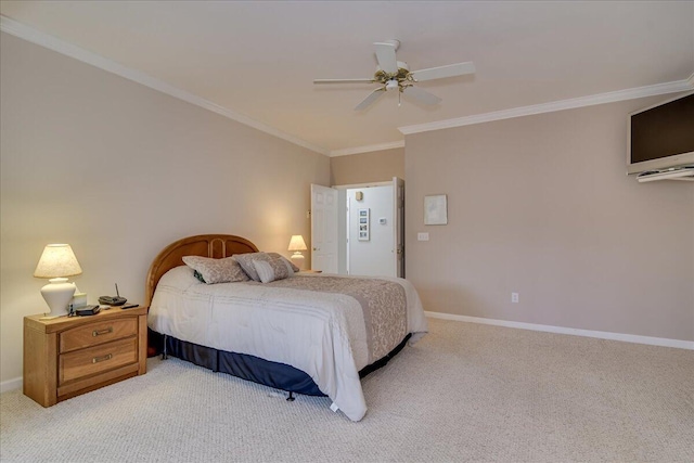 carpeted bedroom featuring ceiling fan and ornamental molding