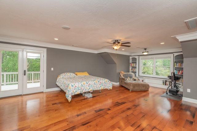 bedroom featuring visible vents, access to outside, multiple windows, and wood-type flooring