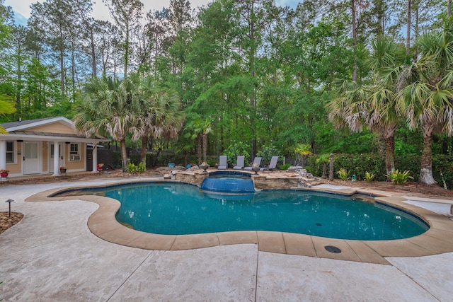 view of pool featuring a patio area and a pool with connected hot tub