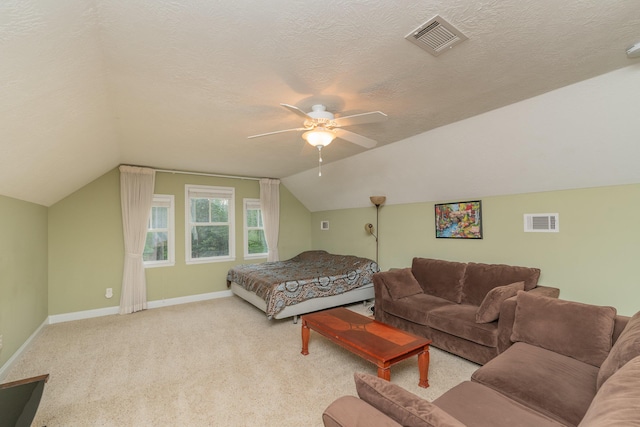carpeted bedroom with baseboards, visible vents, ceiling fan, and lofted ceiling
