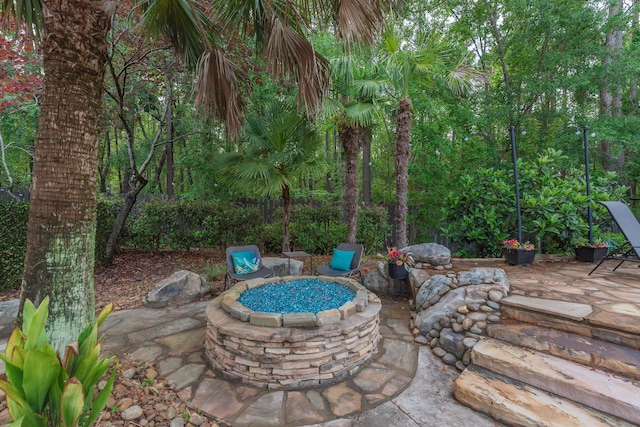view of patio featuring a fire pit