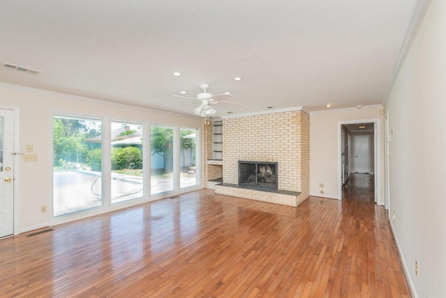 3411 Kamel Cir, Augusta, GA 30909 - unfurnished living room with ornamental molding, light wood-type flooring, ceiling fan, a fireplace, and baseboards