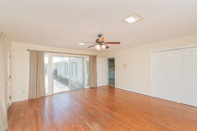 3411 Kamel Cir, Augusta, GA 30909 - unfurnished bedroom featuring access to exterior, light wood-style floors, crown molding, baseboards, and ceiling fan