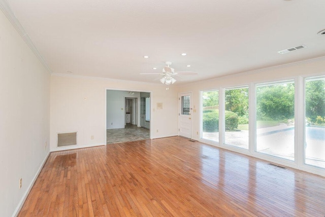 3411 Kamel Cir, Augusta, GA 30909 - spare room featuring light wood-style floors, healthy amount of natural light, ornamental molding, baseboards, and a ceiling fan