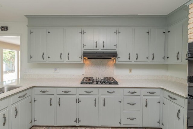 3411 Kamel Cir, Augusta, GA 30909 - kitchen featuring under cabinet range hood, gas stovetop, light countertops, ornamental molding, and white cabinetry