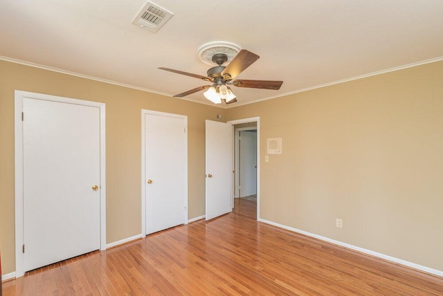 3411 Kamel Cir, Augusta, GA 30909 - unfurnished bedroom featuring crown molding, light wood finished floors, baseboards, and a ceiling fan