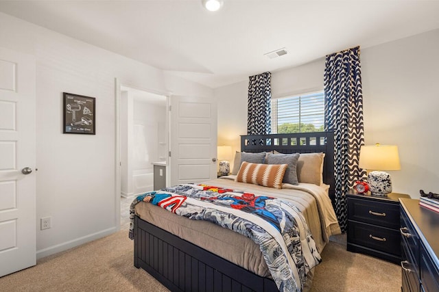 3445 Firestone Dr, Hephzibah, GA 30815 - bedroom with baseboards, light colored carpet, visible vents, and ensuite bath