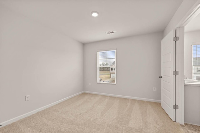 3445 Firestone Dr, Hephzibah, GA 30815 - unfurnished room featuring baseboards, light carpet, and visible vents