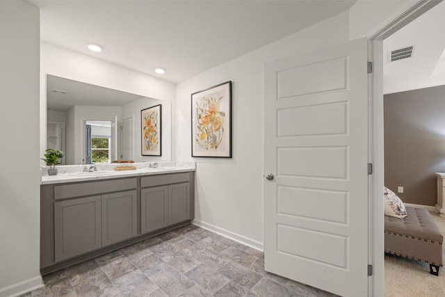 3445 Firestone Dr, Hephzibah, GA 30815 - bathroom with visible vents, a sink, baseboards, and ensuite bathroom