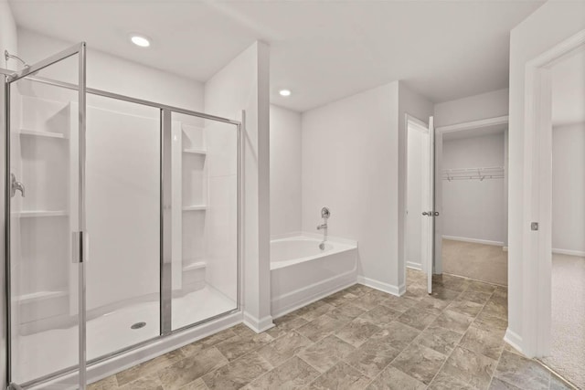 3445 Firestone Dr, Hephzibah, GA 30815 - full bath featuring baseboards, a shower stall, a bath, and a spacious closet