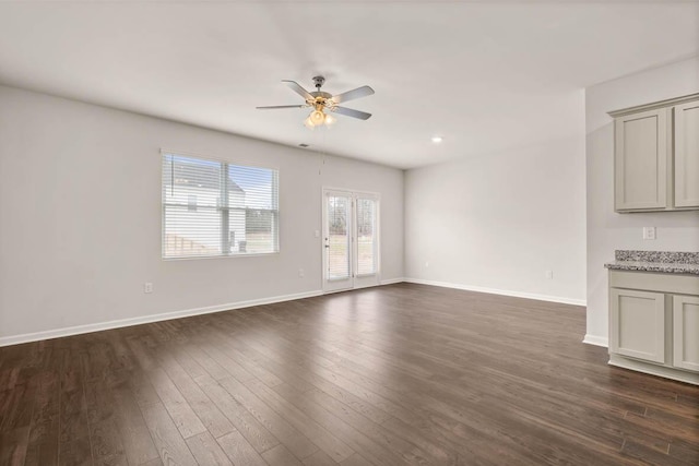 3445 Firestone Dr, Hephzibah, GA 30815 - unfurnished living room with baseboards, ceiling fan, and dark wood-style floors