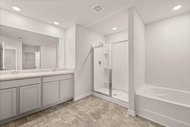 3445 Firestone Dr, Hephzibah, GA 30815 - full bath featuring visible vents, a sink, baseboards, and a shower stall