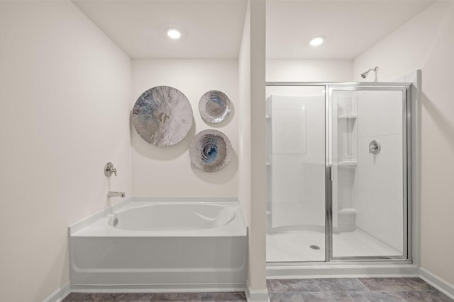 3445 Firestone Dr, Hephzibah, GA 30815 - full bath featuring baseboards, a garden tub, and a stall shower