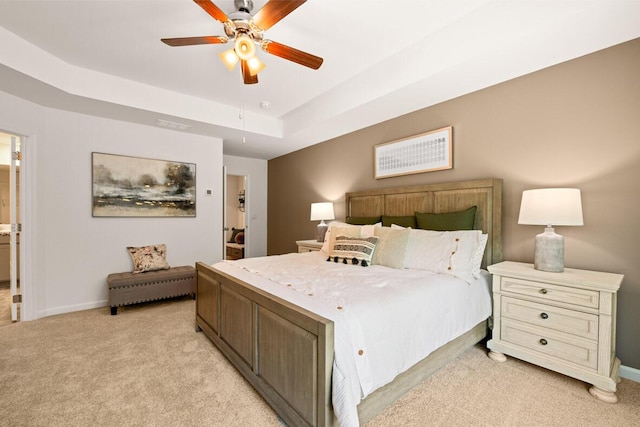 3445 Firestone Dr, Hephzibah, GA 30815 - bedroom featuring a tray ceiling, baseboards, light carpet, and a ceiling fan