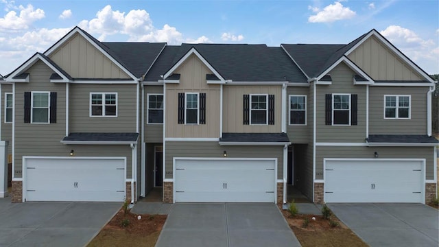 3445 Firestone Dr, Hephzibah, GA 30815 - view of property with an attached garage, board and batten siding, and stone siding
