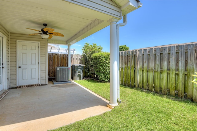 view of patio / terrace with ceiling fan and central AC