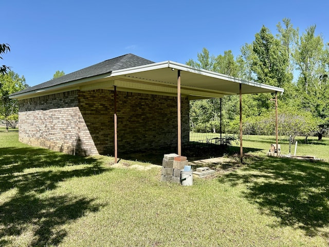 view of home's exterior featuring a lawn and brick siding