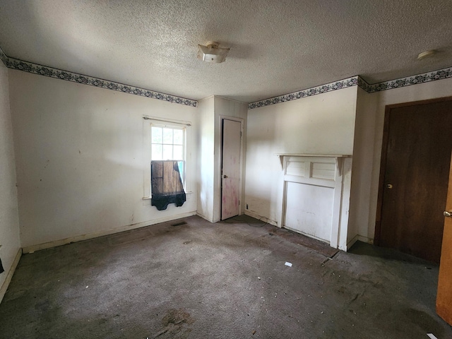 interior space with a textured ceiling