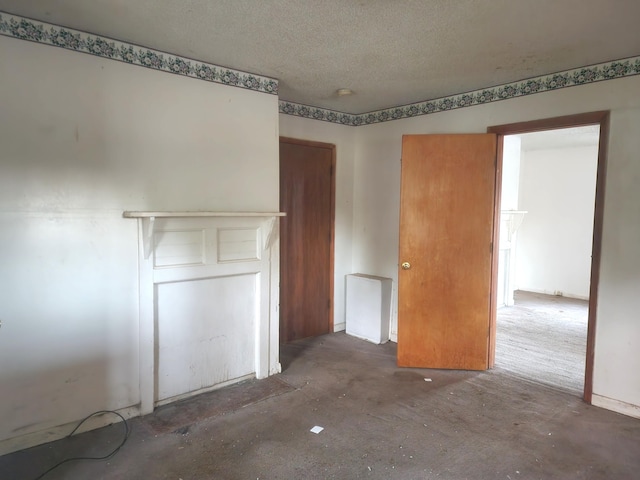 spare room featuring a textured ceiling