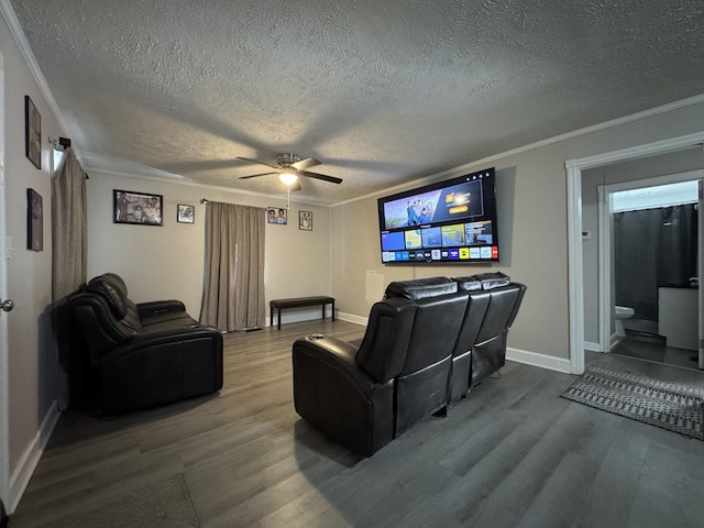 2402 Wheeless Rd, Augusta, GA 30906 - home theater featuring wood finished floors, a textured ceiling, a ceiling fan, and crown molding