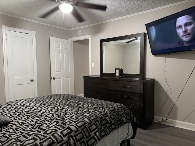 2402 Wheeless Rd, Augusta, GA 30906 - bedroom featuring wood finished floors, a textured ceiling, ceiling fan, and ornamental molding