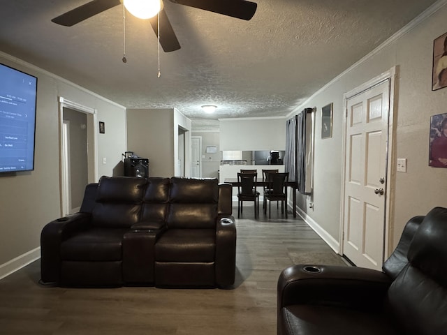 2402 Wheeless Rd, Augusta, GA 30906 - living area featuring a textured ceiling, wood finished floors, ceiling fan, and crown molding