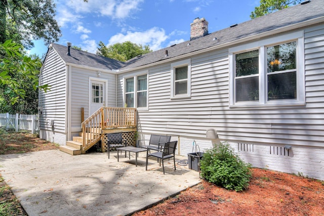 1703 Holly Hill Rd, Augusta, GA 30904 - rear view of property featuring a patio, crawl space, a chimney, and central AC