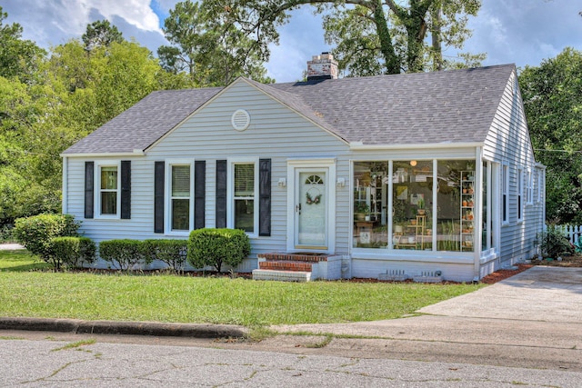 1703 Holly Hill Rd, Augusta, GA 30904 - view of front of house with roof with shingles, a chimney, a front lawn, and entry steps