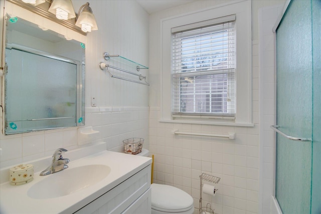 full bathroom with toilet, a shower with door, and vanity