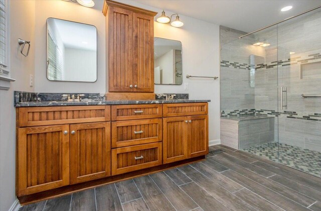 2924 Stratford Dr, Augusta, GA 30909 - full bath featuring a shower stall, wood finished floors, and double vanity