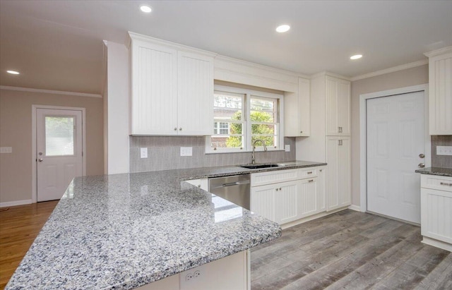 2924 Stratford Dr, Augusta, GA 30909 - kitchen featuring dishwasher, crown molding, decorative backsplash, light wood-style flooring, and light stone countertops