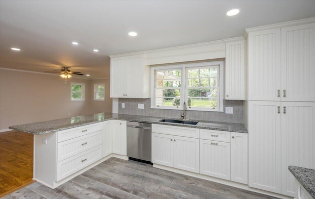 2924 Stratford Dr, Augusta, GA 30909 - kitchen featuring stainless steel dishwasher, a peninsula, backsplash, recessed lighting, and light wood finished floors