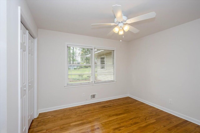 2924 Stratford Dr, Augusta, GA 30909 - unfurnished bedroom with a closet, wood finished floors, and ceiling fan