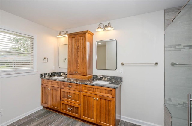 2924 Stratford Dr, Augusta, GA 30909 - bathroom featuring double vanity, wood finished floors, and a tile shower