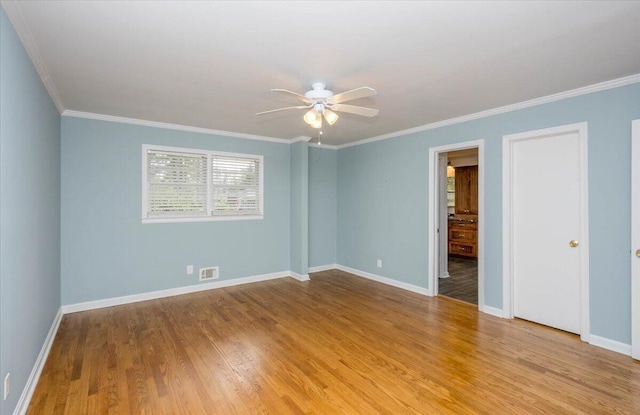 2924 Stratford Dr, Augusta, GA 30909 - empty room featuring a ceiling fan, wood finished floors, and crown molding