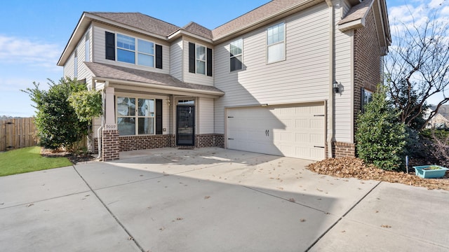 view of front of property with a garage