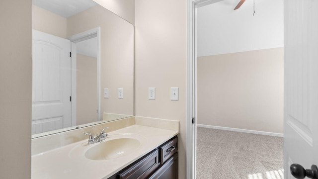 bathroom featuring ceiling fan and vanity