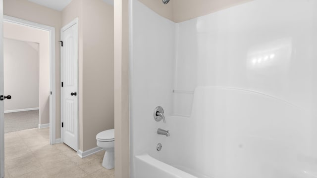 bathroom featuring toilet and shower / washtub combination