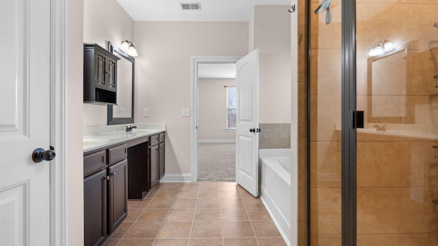 bathroom featuring separate shower and tub, vanity, and tile patterned flooring