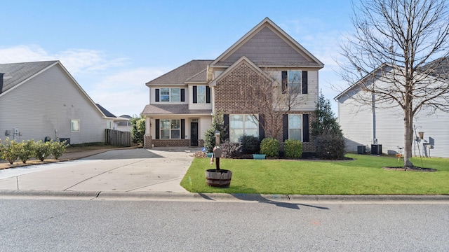 view of front of home featuring central AC and a front yard