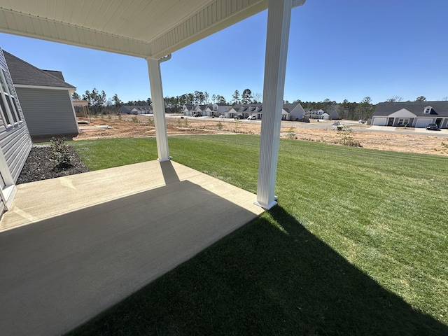 view of yard with a patio area and a residential view