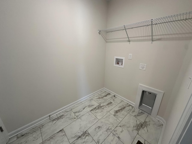 clothes washing area with electric dryer hookup, washer hookup, marble finish floor, baseboards, and laundry area