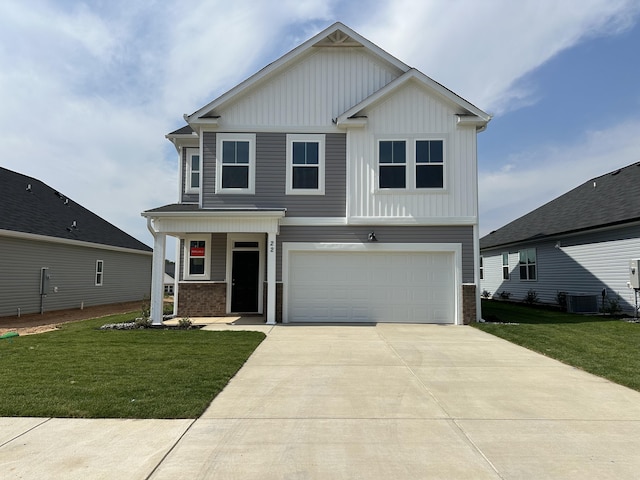 view of front facade with a front lawn, cooling unit, board and batten siding, concrete driveway, and a garage