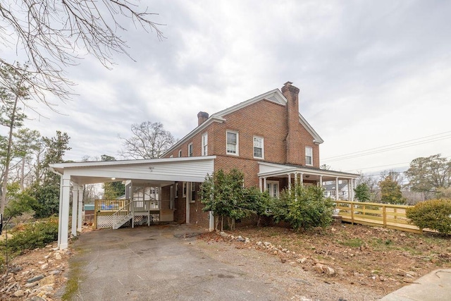 exterior space featuring a porch and a carport
